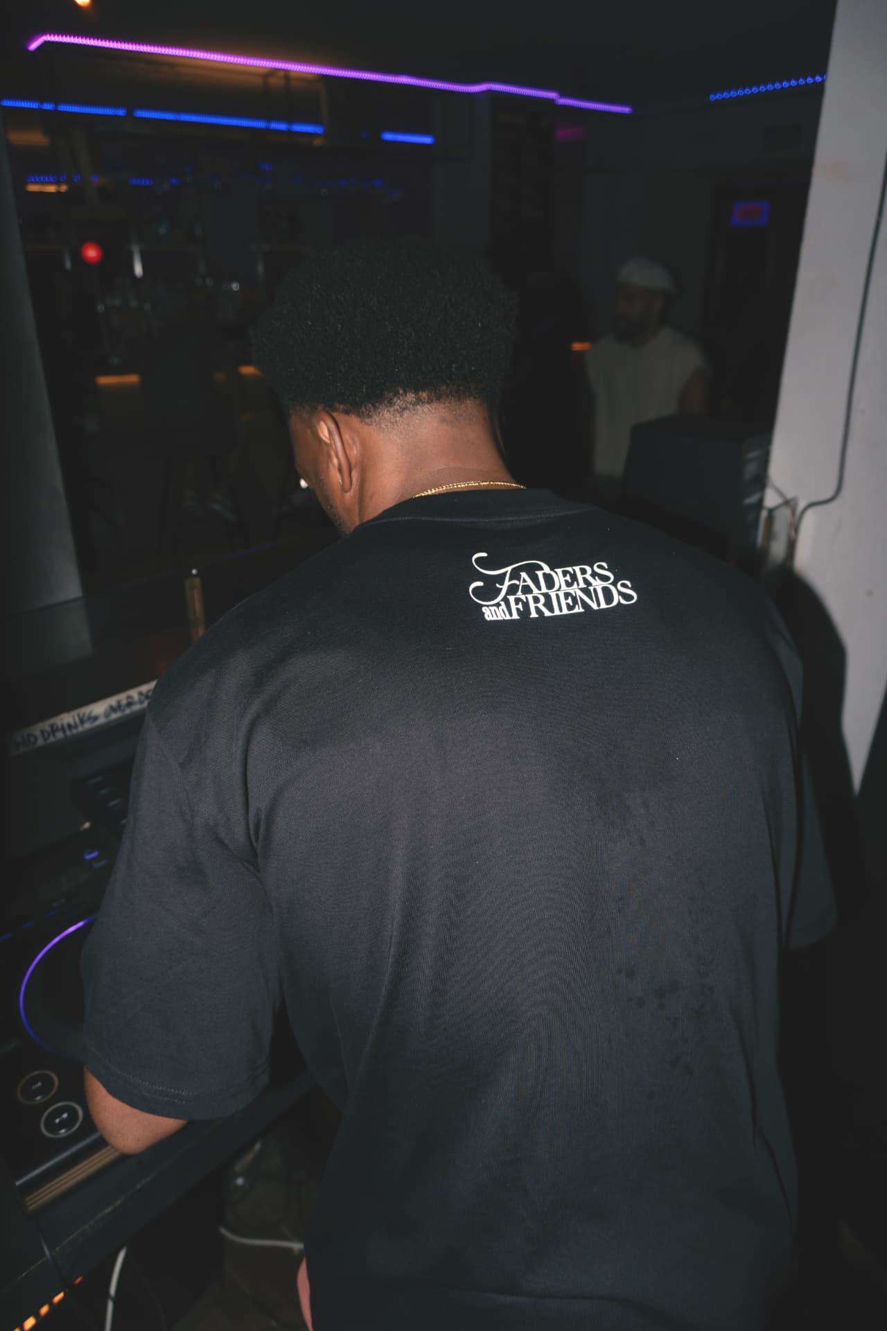 Back of the tee with the Faders & Friends logo, in the club